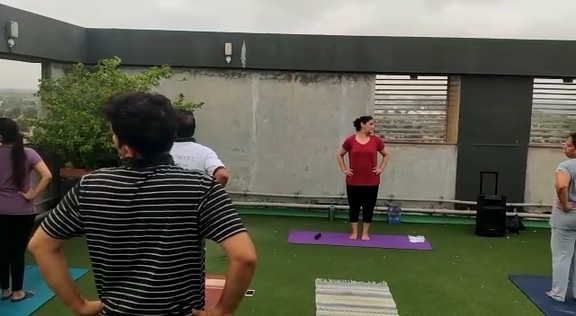Dr. Sunita leading outdoor yoga class