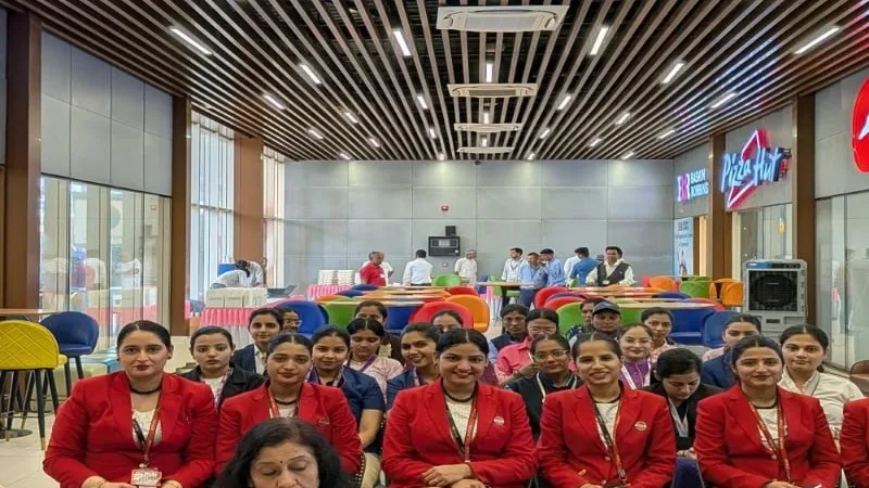 Dr. Ashok and Dr. Sunita Sajnani with airport staff at Women's Day, Ahmedabad Airport 2025
